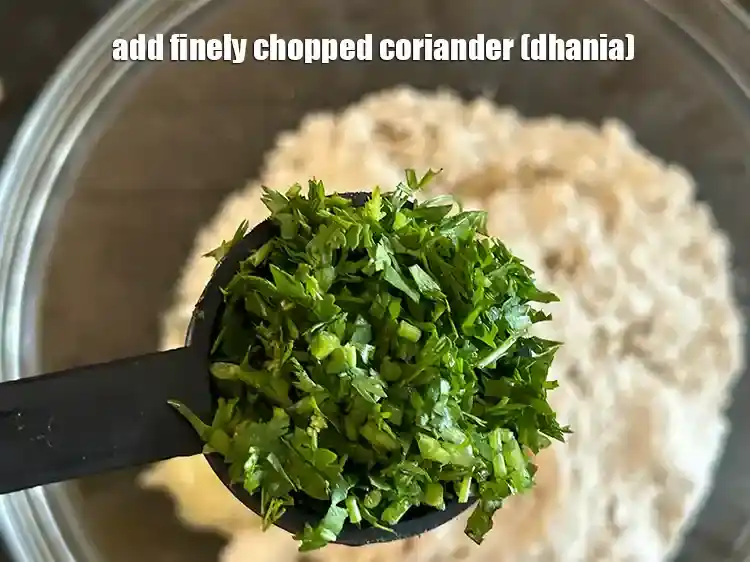 Step 10 – <p>Add 1/4 cup finely <a href="https://www.tarladalal.com/glossary-coriander-dhania-kothmir-369i#ing_2365"><u>chopped coriander (dhania)</u></a><u>.</u></p>