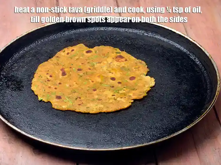 Step 14 – <p>Heat a non-stick tava (griddle) and cook, using ¼ tsp of <a href="https://www.tarladalal.com/glossary-oil-671i"><u>oil</u></a>, till golden …