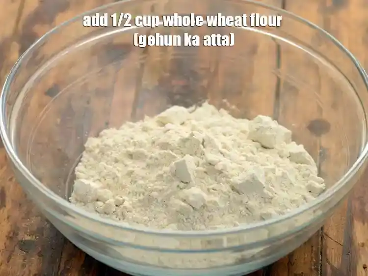 Step 4 – <p>Add 1/2 cup <a href="https://www.tarladalal.com/glossary-whole-wheat-flour-gehun-ka-atta-gehun-ka-aata-429i"><u>whole wheat flour (gehun ka atta)</u></a><u>.</u></p>