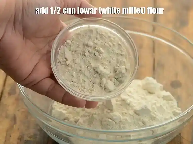 Step 5 – <p>Add 1/2 cup <a href="https://www.tarladalal.com/glossary-jowar-flour-jowar-ka-atta-white-millet-flour-sorghum-flour-483i"><u>jowar (white millet) flour</u></a><u>.</u></p>