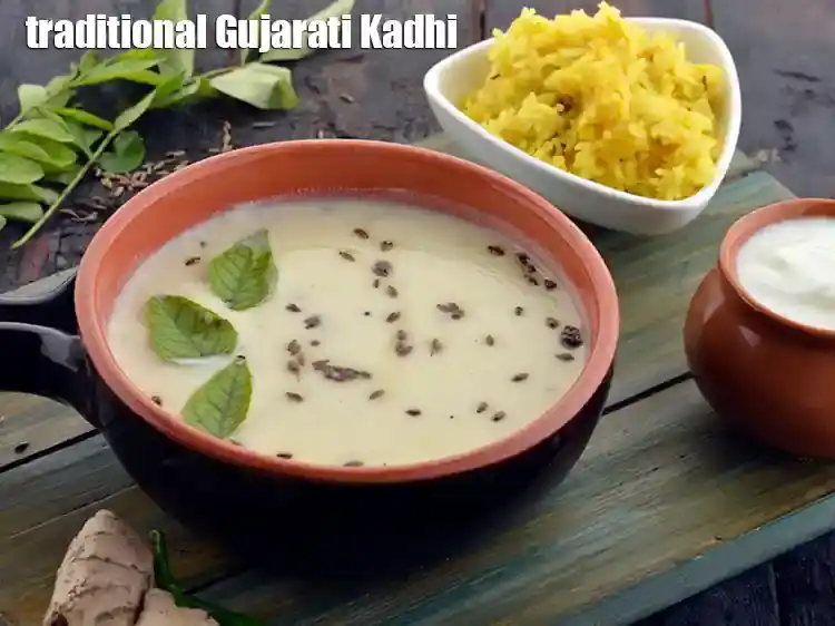 Step 13 – <p><span style="background-color:rgb(255,255,255);color:rgb(0,0,0);">Garnish the </span><strong>gujarati kadhi</strong><span style="background-color:rgb(255,255,255);color:rgb(0,0,0);"> with coriander and serve hot with rotli, puran poli …