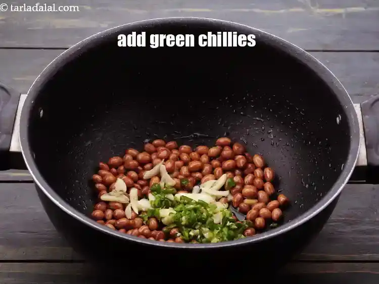 Step 11 – <p>Add <a href="https://www.tarladalal.com/glossary-green-chillies-hari-mirch-331i#ing_820">green chillies</a>. Use the dark green variety of green chillies which is spicy.</p>