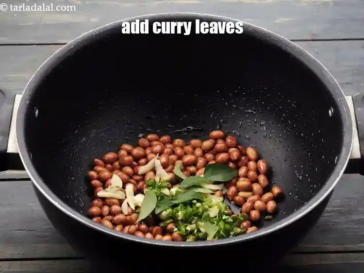 Step 12 – <p>Add <a href="https://www.tarladalal.com/glossary-curry-leaves-kadi-patta-kadipatta-388i">curry leaves</a>.</p>