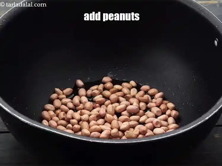 Step 6 – <p>Add the <a href="https://www.tarladalal.com/glossary-raw-peanuts-kachi-mungfali-kachi-moongfali-847i">peanuts</a>.</p>