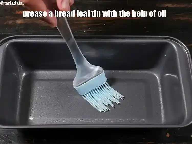 Step 26 – <p>Grease a bread loaf tin of 200 mm. (8”) with the help of oil.</p>
