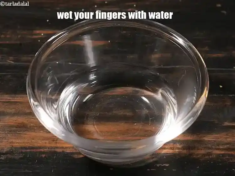 Step 28 – <p>Wet your fingers with water.</p>