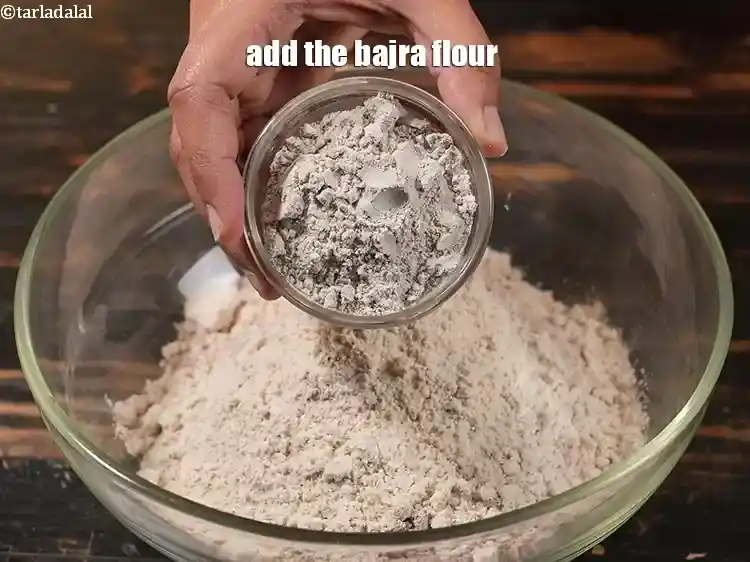 Step 16 – <p>Next, add the 1/4 cup <a href="https://www.tarladalal.com/glossary-bajra-flour-bajra-ka-atta-bajre-ka-atta-176i"><u>bajra (black millet) flour</u></a>.</p>