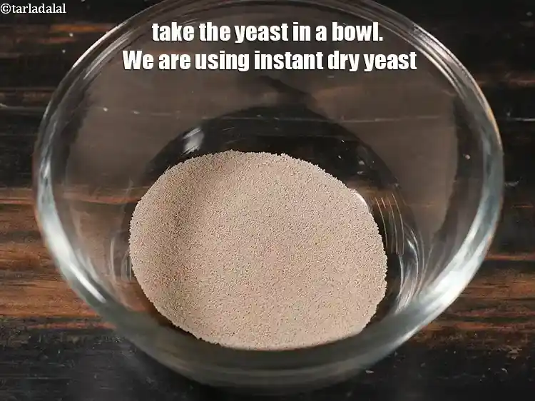 Step 7 – <p>For the yeast mixture of <strong>multigrain bread</strong>, take the 1 tbsp <a href="https://www.tarladalal.com/glossary-dry-yeast-sukha-khamir-657i#ing_2845"><u>instant dry yeast</u></a> …