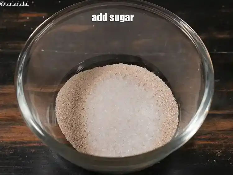 Step 8 – <p>Add the 1 tbsp sugar / 1 tbsp <a href="https://www.tarladalal.com/glossary-castor-sugar-279i"><u>castor sugar</u></a> Sugar has multiple roles …