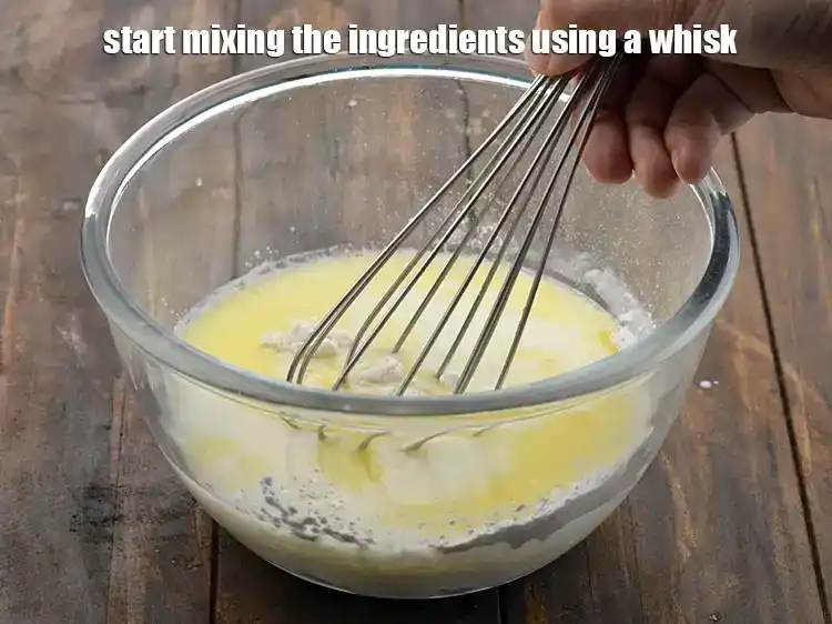 Step 12 – <p><span style="background-color:rgb(255,255,255);color:rgb(0,0,0);">Start mixing the ingredients using a whisk.</span></p>