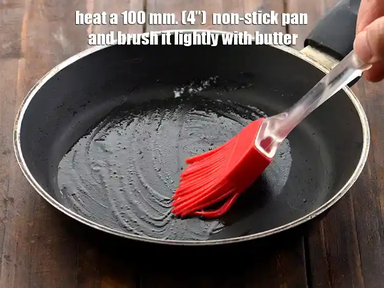 Step 14 – <p><span style="background-color:rgb(255,255,255);color:rgb(0,0,0);">Heat a 100 mm. (4”) non-stick pan and brush it lightly with </span><a href="https://www.tarladalal.com/glossary-butter-makhan-233i#ing_3123"><u>butter</u></a><span …