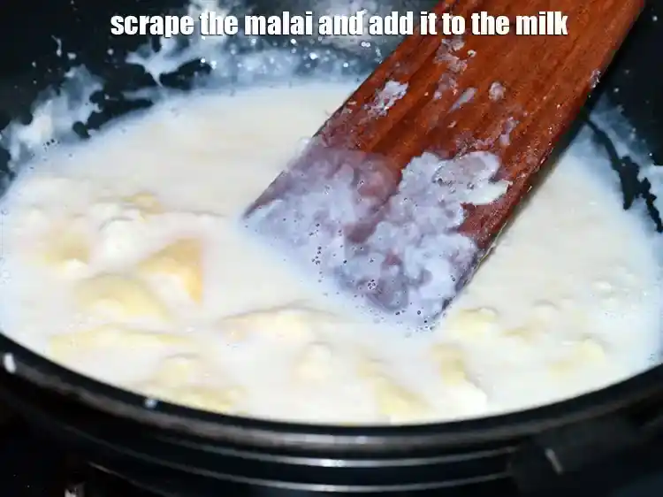 Step 22 – <p><span style="background-color:rgb(255,255,255);color:rgb(0,0,0);">Scrape the malai and add it to the milk.</span></p>