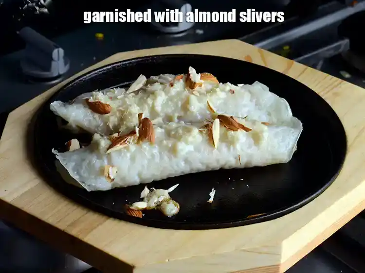 Step 28 – <p><span style="background-color:rgb(255,255,255);color:rgb(0,0,0);">Garnished with </span><a href="https://www.tarladalal.com/glossary-almond-slivers-slivered-almonds-664i"><u>almond (badam) slivers</u></a><span style="background-color:rgb(255,255,255);color:rgb(0,0,0);">. </span>Repeat steps 3 to 5 to make …