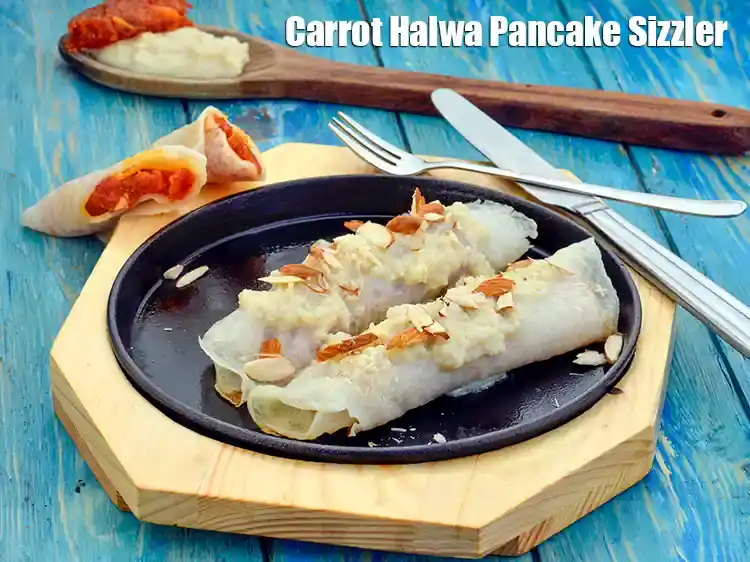 Step 29 – <p><span style="background-color:rgb(255,255,255);color:rgb(0,0,0);">Serve <strong>Carrot Pancake Sizzler, Carrot Halwa Pancake Sizzler</strong>, immediately.</span></p>