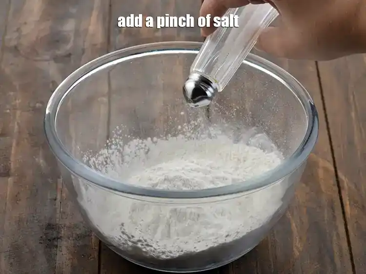 Step 8 – <p>Add a pinch of <a href="https://www.tarladalal.com/glossary-salt-namak-table-salt-418i"><u>salt</u></a><u>.</u></p>