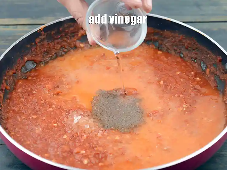 Step 22 – <p>Add 1 tsp&nbsp;<a href="https://www.tarladalal.com/glossary-vinegar-sirka-cooking-vinegar-341i">vinegar</a>. Vinegar's acidic nature brings a sharp, tangy flavor to the chutney. …