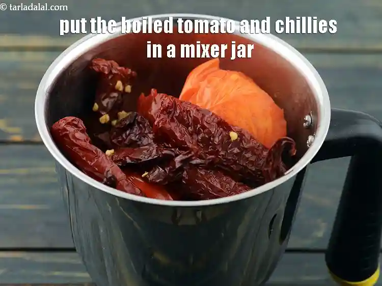 Step 8 – <p>Put the boiled tomato and chillies in a mixer jar.</p>