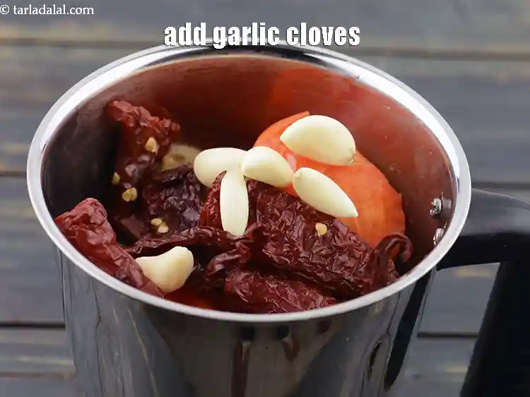 Step 9 – <p>Add 10 to 12&nbsp;<a href="https://www.tarladalal.com/glossary-garlic-cloves-1857i">garlic (lehsun) cloves</a>. Garlic brings a sharp, savory bite that complements …