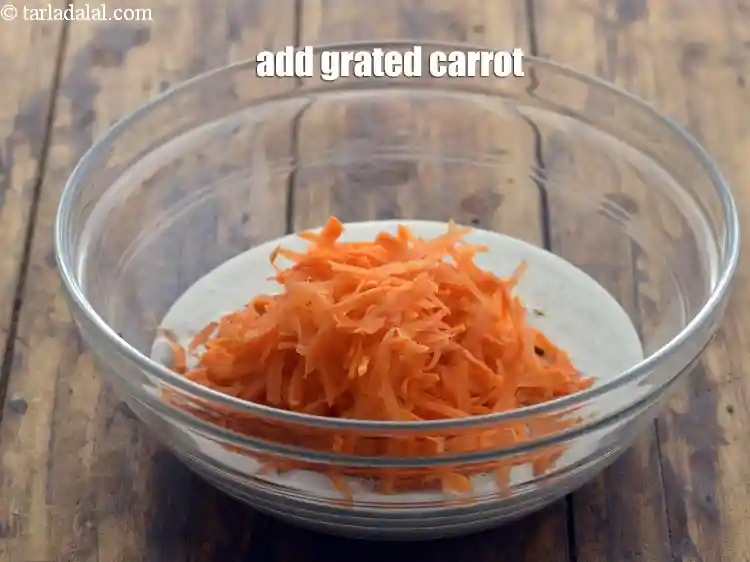 Step 13 – <p>Add grated carrot. Other vegetables like grated beetroot, doodhi, mooli can also be used.</p>