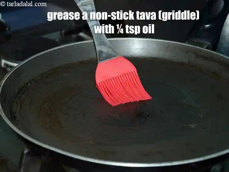 Step 18 – <p>To make&nbsp;<strong>high fibre chillas, </strong>grease a non-stick tava (griddle) with ¼ tsp oil.</p>
