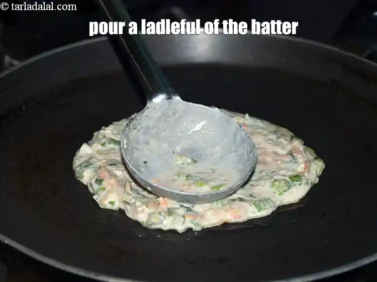Step 19 – <p>Pour a ladleful of the batter.</p>