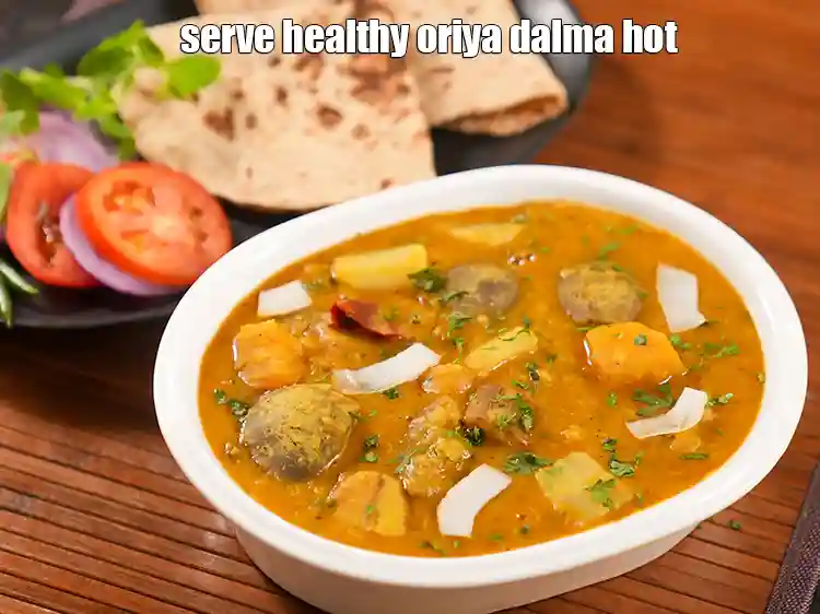 Step 40 – <p>Serve <strong>odia dalma </strong>hot garnished with coriander and <a href="https://www.tarladalal.com/glossary-coconut-flakes-2797i">coconut flakes</a>.</p>