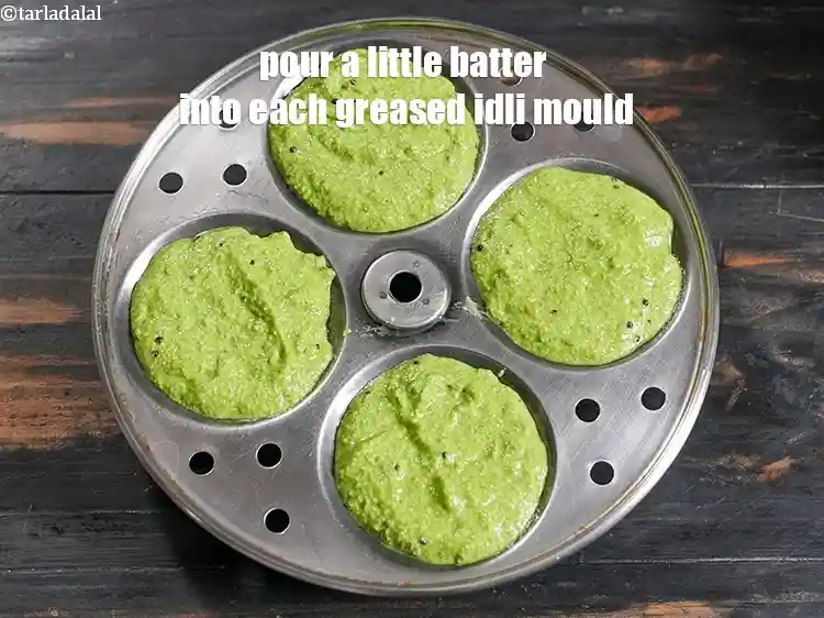 Step 20 – <p>Pour a little batter into each greased idli mould.&nbsp;</p>