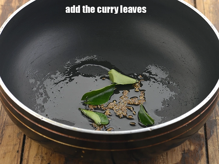 Step 7 – <p>જ્યારે બીજ તતડવા લાગે, ત્યારે તેમાં કઢી પત્તા ઉમેરો. કઢી પત્તા પૌષ્ટિક મૂંગ સૂપને તાજગીભર્યો …