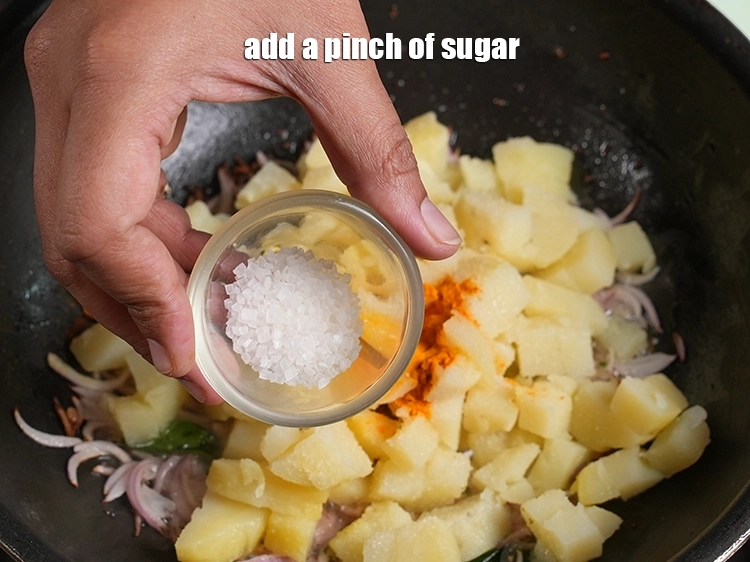 Step 13 – <p style="margin-left:0px;">એક ચપટી <a href="/glossary-sugar-chini-shakkar-gujarati-278i"><u>સાકર (sugar)</u></a><u> </u>ઉમેરો. <span style="background-color:rgb(255,255,255);color:rgb(0,0,0);">Add </span><span style="background-color:rgb(255,255,255);color:rgb(13,13,13);">a pinch of </span><a href="https://www.tarladalal.com/glossary-sugar-chini-shakkar-278i"><strong><u>sugar</u></strong></a><strong>.</strong></p>