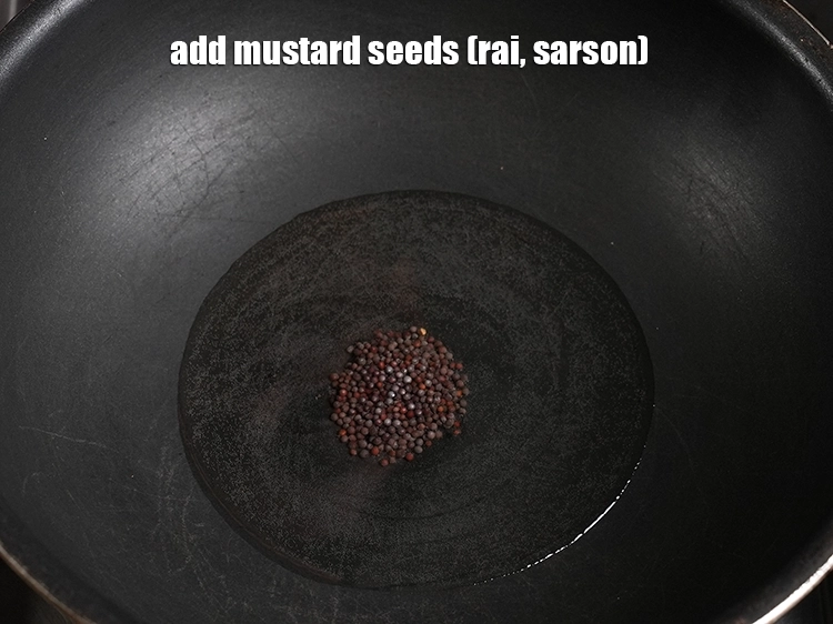 Step 3 – <p>તેલ ગરમ થાય એટલે તેમાં 1/2 ટીસ્પૂન <a href="/glossary-mustard-seeds-sarson-rai-sarson-ke-beej-gujarati-525i"><u>રાઇ (mustard seeds ( rai / sarson)</u></a> …