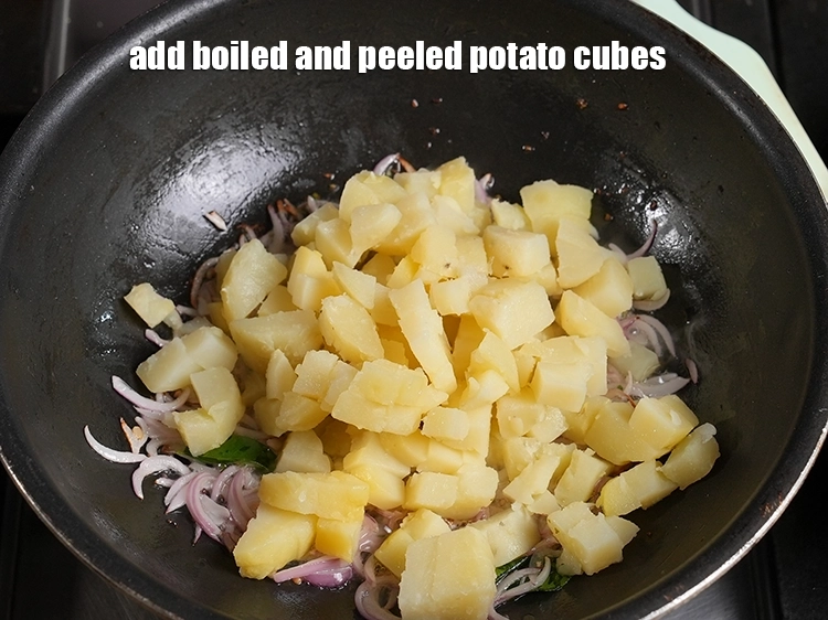 Step 10 – <p style="margin-left:0px;">1 1/4 કપ <a href="/glossary-potatoes-aloo-alu-batata-gujarati-710i#ing_2605"><u>બાફેલા બટાટાના ટુકડા</u></a><u>&nbsp;</u> ઉમેરો. આને બાફેલા, છોલીને ક્યુબ્સમાં કાપેલા અને …