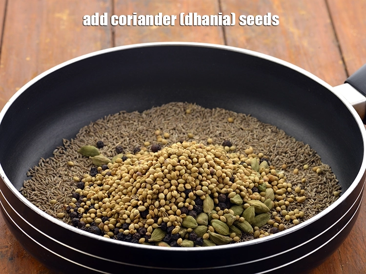 Step 7 – <p style="margin-left:0px;">1/4 કપ <a href="/glossary-coriander-seeds-dhania-ke-beej-dhania-seeds-akha-dhania-gujarati-371i"><u>આખા ધાણા (coriander seeds)</u></a> ઉમેરો. ઘણા લોકો દરેક મસાલાને ધીમે ધીમે …