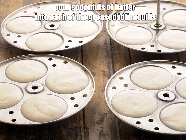 Step 34 – <p>દરેક ગ્રીસ કરેલા ઈડલીના મોલ્ડમાં ચમચીભર ખીરું નાખો. મોલ્ડને વધારે ન ભરો, કારણ કે ઈડલી …