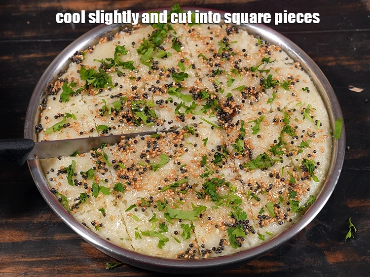 Step 28 – <p>સહેજ ઠંડુ કરો, રવા ઢોકળા (સોજી ઢોકળા) ના ચોરસ ટુકડા કરો. <span style="background-color:rgb(255,255,255);color:rgb(0,0,0);">Cool slightly, cut&nbsp;</span><strong>Rava …