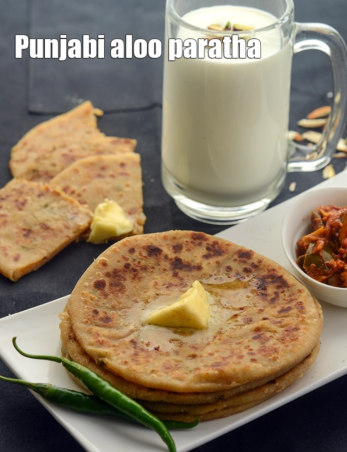 Step 28 – <p>આલુ પરાઠાને તાજા ઘરે બનાવેલા દહીં અથવા લસ્સી અને અથાણા સાથે ગરમાગરમ પીરસો. Serve <strong>aloo …