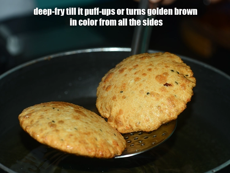 Step 22 – <p>અડદ દાળ પુરીને ફૂલવા માટે ચમચી વડે હળવેથી દબાવો. એકવાર તે ગોલ્ડન બ્રાઉન અને તળિયે …