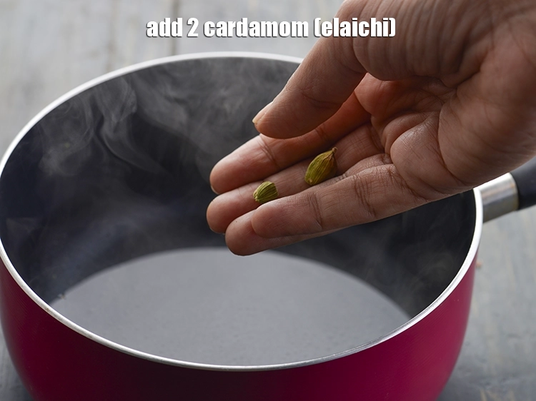 Step 4 – <p>એલચી ઉમેરો. ઉમેરતા પહેલા, ઇલાયચીને થોડો ક્રશ કરો જેથી તેનો સ્વાદ સારો આવે. Add the …