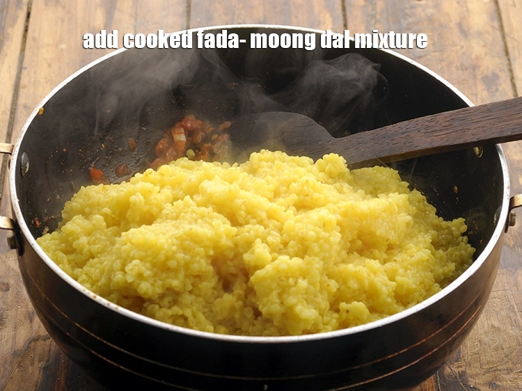 Step 28 – <p><span style="background-color:rgb(255,255,255);color:rgb(0,0,0);">રાંધેલા ફડા-મગની દાળનું મિશ્રણ ઉમેરો. Add the cooked fada- </span><i>moong dal</i><span style="background-color:rgb(255,255,255);color:rgb(0,0,0);"> mixture.</span></p>