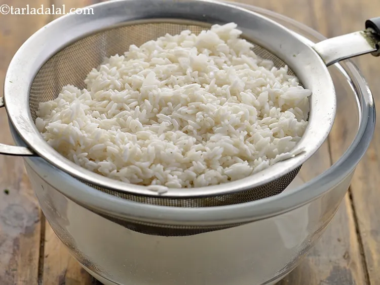 Step 27 – <p>ચોખા, બાફેલા ચોખા અને જાડા ચોખાના ટુકડા કાઢી લો. Drain the rice, parboiled rice and …