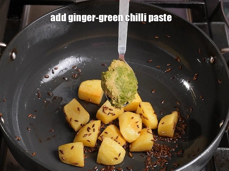 Step 15 – <p style="margin-left:0px;">ગેસ ધીમો કરો, 1 ટેબલસ્પૂન <a href="https://www.tarladalal.com/glossary-ginger-green-chilli-paste-adrak-mirch-ki-paste-adrak-mirchi-paste-gujarati-139i"><u>આદુ-લીલા મરચાંની પેસ્ટ (ginger-green chilli paste)</u></a><u>&nbsp;</u> ઉમેરો. Lower …