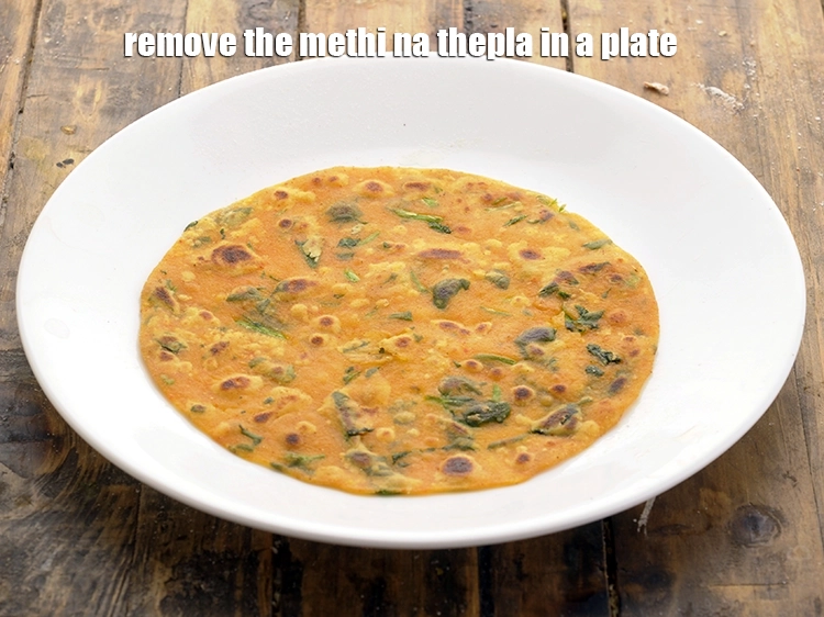 Step 19 – <p>મેથીના થેપલાને પ્લેટમાં કાઢી લો અને બાકીના ૨૧ ભાગોને એકસરખા રાંધો. તેમને એક ઉપર બીજા …