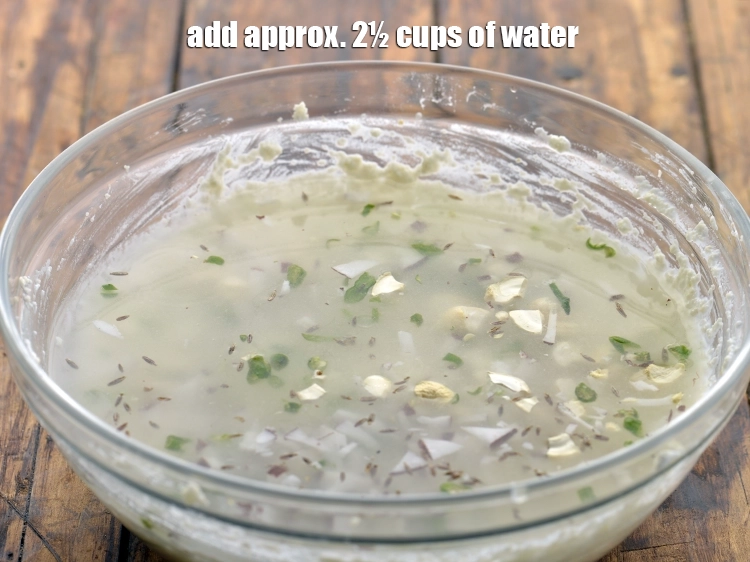Step 17 – <p>લગભગ 2½ કપ પાણી ઉમેરો અને ગઠ્ઠા ન રહે ત્યાં સુધી સારી રીતે મિક્સ કરો.</p>