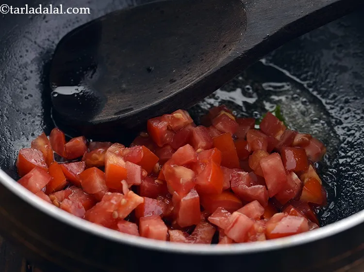 Step 49 – <p>ટામેટાં ઉમેરો. તે દક્ષિણ ભારતીય શાકભાજી સાંભારને તીખો સ્વાદ આપે છે. Add the tomatoes. They …