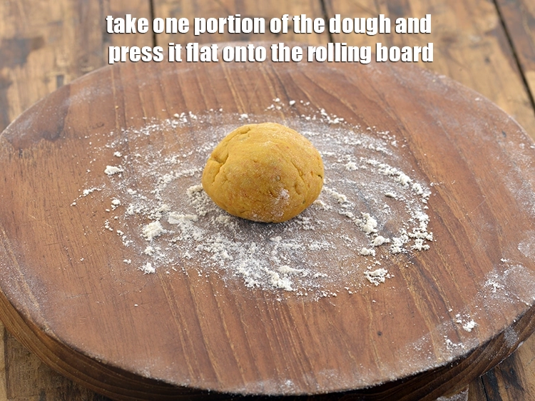 Step 12 – <p>રોલિંગ બોર્ડ લો અને તેના પર થોડો લોટ છાંટો. લોટનો એક ભાગ લો અને તેને …