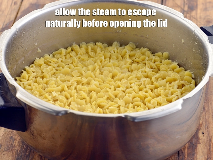 Step 22 – <p>ઢાંકણ બંધ કરો અને 3 સીટી સુધી પ્રેશર કૂક કરો. ઢાંકણ ખોલતા પહેલા વરાળ કુદરતી …