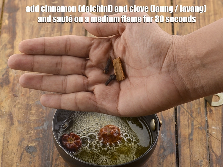 Step 40 – <p>તજ અને લવિંગ પણ ઉમેરો અને મધ્યમ તાપ પર ૩૦ સેકન્ડ માટે સાંતળો.</p>