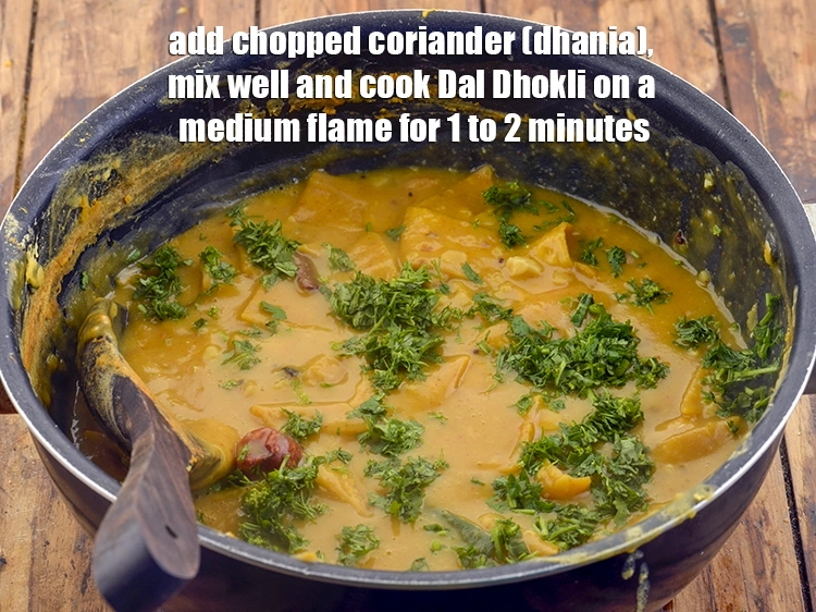 Step 46 – <p><span style="background-color:rgb(255,255,255);color:rgb(0,0,0);">કોથમીર ઉમેરો, સારી રીતે મિક્સ કરો અને દાળ ઢોકળી મધ્યમ તાપ પર 1 થી …