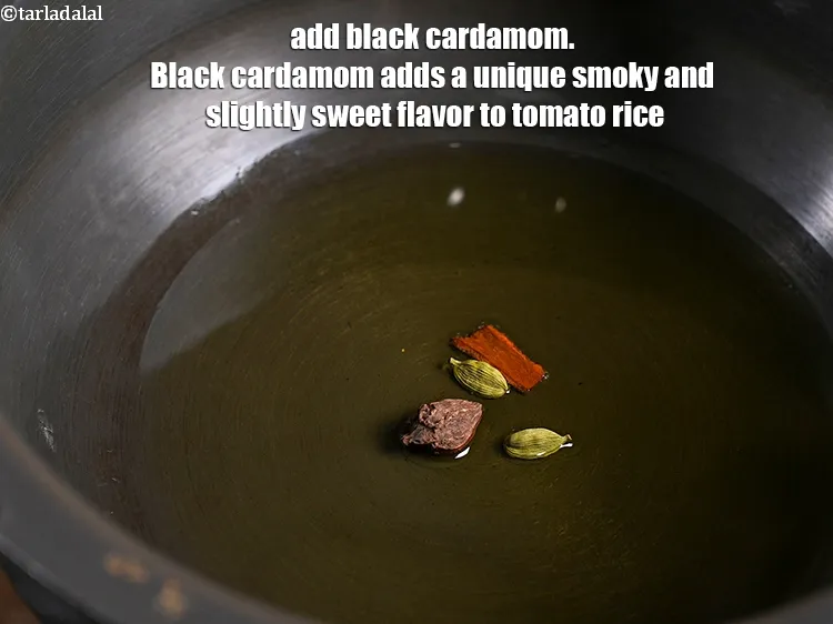 Step 5 – <p><span style="background-color:rgb(255,255,255);color:rgb(0,0,0);">1 </span><a href="https://www.tarladalal.com/glossary-black-cardamom-badi-elaichi-moti-elaichi-gujarati-263i"><u>મોટી કાળી એલચી (black cardamom, badi elaichi)</u></a> ઉમેરો. કાળી એલચી ટામેટા ભાતમાં …