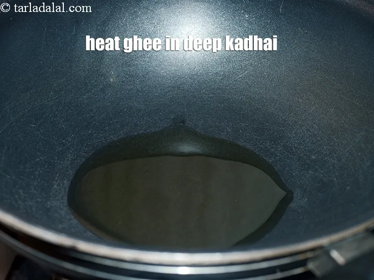 Step 3 – <p><strong>અખરોટનો શીરો</strong> બનાવવા માટે, એક ઊંડા નોન-સ્ટીક કઢાઈમાં <span style="background-color:rgb(255,255,255);color:rgb(0,0,0);">4 ટેબલસ્પૂન ઓગાળેલું </span><a href="https://www.tarladalal.com/glossary-ghee-gujarati-245i"><u>ઘી (ghee)</u></a> …