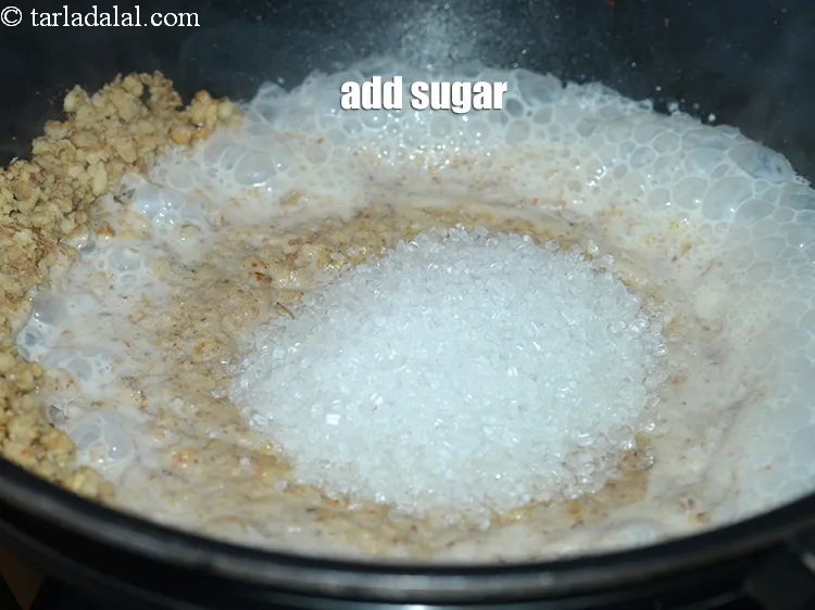 Step 7 – <p><span style="background-color:rgb(255,255,255);color:rgb(0,0,0);">1/2 કપ </span><a href="https://www.tarladalal.com/glossary-sugar-chini-shakkar-gujarati-278i"><u>સાકર (sugar)</u></a> ઉમેરો.</p>